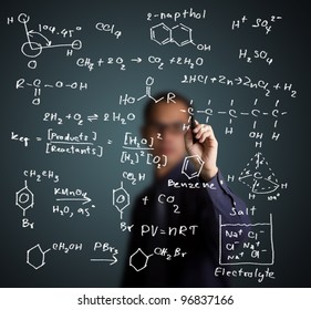 chemistry teacher writing science and chemical formula on whiteboard - Powered by Shutterstock