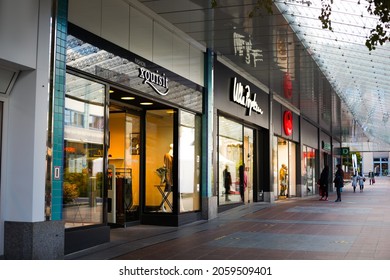 Chemnitz  Germany - 10-16-2021: View Of Outdoor Shopping Mall In Germany. Exterior Of Several Storefronts For A Shopping Area. Image Taken From A Public Access Area