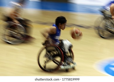 Chen Yi-Chen (C) Of Taiwan Fight For A Ball With Malaysian Players During The Men's Wheelchair Basketball Competition Of The 2018 Asian Para Games In Jakarta On October 7, 2018