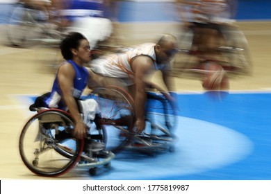 Chen Yi-Chen (L) Of Taiwan Fight For A Ball With Malaysia's Ahmad Nazri Hamzah (R) During The Men's Wheelchair Basketball Competition Of The 2018 Asian Para Games In Jakarta On October 7, 2018