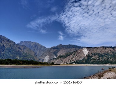 Chenab River Surrounded By Mountains