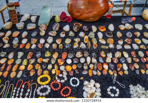 chengdu, China - Aug 20, 2016. Selling\
precious stones at street market in Chengdu, China. Chengdu is the\
capital of southwestern China Sichuan\
province.