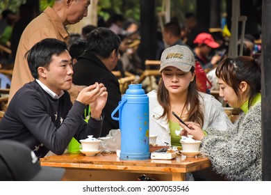 Chengdu, China - June 09 2021: Chinese People Enjoy Afternoon Tea In The Park In Chengdu, China. 