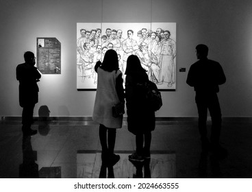 Chengdu, China - June 12th 2021: Silhouette Of Four People Looking At An Artwork At The Sichuan Art Museum