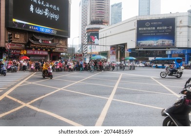 Chengdu, china.  June 27, 2018. A policeman on a motorcycle monitoring the city streets of chengdu china on an overcast day in sichuan province.