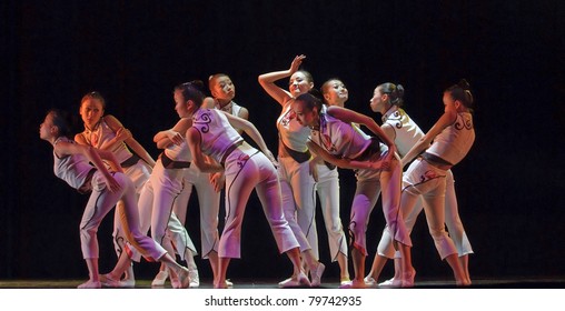 CHENGDU - DEC 14: Chinese Dancers Perform Modern Group Dance On Stage At Golden Theater In The 7th National Dance Competition Of China On Dec 14,2007 In Chengdu, China.