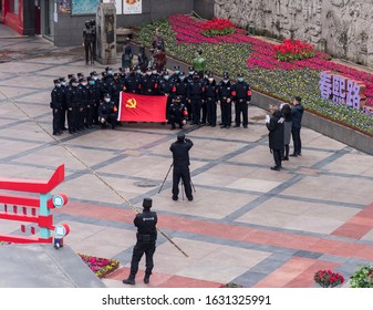 Chengdu, Sichuan / China - January 30 2019: A Few Community Safety Members Wore Masks And Gathered At Shopping District To Swear An Oath To China Communist Party Flag To Prevent Coronavirus Spread.