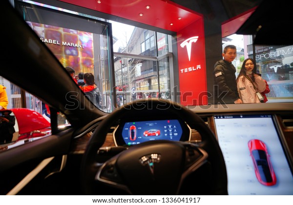 Chengdu,
Sichuan / China - March 02 2019: Chinese consumers testing Tesla
car in the local shopping mall Teslashowroom. Tesla has become the
most popular car brand amid US China trade war.
