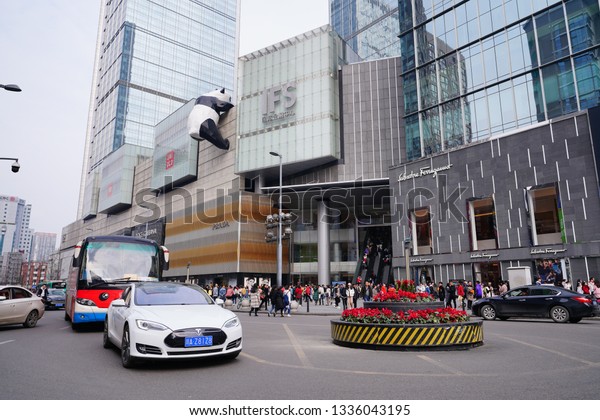 Chengdu, Sichuan / China -\
March 02 2019: Tesla car passing by Chengdu downtown core. Tesla\
has become the most popular car brand in China amid US China trade\
war. 