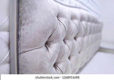 Chenille fabric texture for upholstery of the headboard with pillows, close-up, background of upholstered furniture, style, design - Powered by Shutterstock