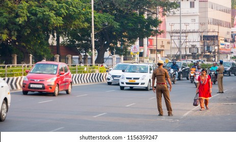 CHENNAI, INDIA - JANUARY 2018 :Traffic Police Controlling The Vehicles On The Road. Passengers And Commuters In The Downtown Of Chennai, Tamil Nadu, India