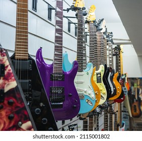 Chennai, India - January 28, 2022: A Collection Of Colorful Electric Guitars On Display At A Music Store.