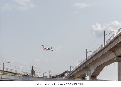 Chennai India July 29 2018 National Highway (known As Kathipaara Junction Near Guindy) Seen With Separate Lanes With Metro Train. Aeroplane Seen Flying Above The Metro Station.