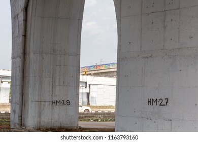 Chennai India July 29 2018 National Highway (known As Kathipaara Junction Near Guindy) Seen Separate Lanes With Metro Train Moving On Flyover,pillars In The Foreground