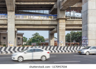 Chennai India July 29 2018,national Highway (known Kathipaara Junction Near Guindy),vehicles Speeding On The Road On Separate Lanes With Metro Train Moving On Flyover