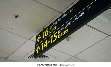 Chennai, India - March 12, 2021: Signboard Displaying Boarding Gate Information In English, Tamil, And Hindi At The Chennai International Airport .