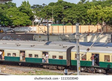 Chennai India May 27 2018 People Seen Travelling In Local Electric Train Towards Marina Beach Station. Location Is Guindy Railway Station. People Seen Footboarding In The Train Which Is Risky At Times