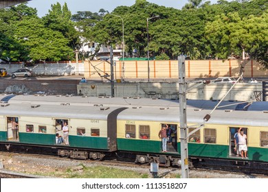 Chennai India May 27 2018 People Seen Travelling In Local Electric Train Towards Marina Beach Station. Location Is Guindy Railway Station. People Seen Footboarding In The Train Which Is Risky At Times