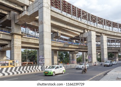 Chennai India,july 29.2018,national Highway (known As Kathipaara Junction Near Guindy) Vehicles Speeding On Road On Separate Lanes With Metro Train Moving On Flyover