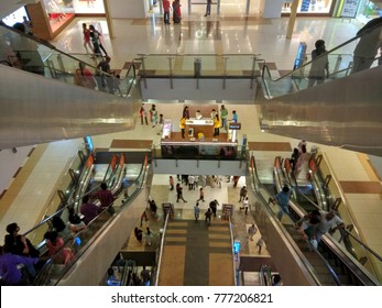 Chennai Mall,Chennai,India Dec 09 2017:Interior View Of Mall Where People Are Using Escalator To Hangout With Family And Do Shopping.Low Light Photography. 