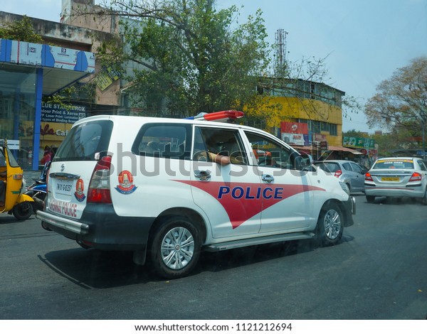 CHENNAI, TAMIL NADU, INDIA, MARCH 31, 2018: A patrolling\
police car on Chennai roads on a sunny day.                        \
     