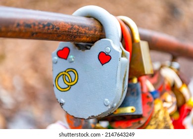 Cherepovets, Russia, April 11, 2022 Wedding lock in soft focus as a symbol of love, tenderness, romance, eternity and endless love for lovers. Padlocks are attached to the bridge, love locks. 