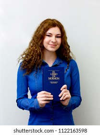 Cherkassy, Ukraine - 29 April 2018. Happy Girl Is Holding Spanish Book Of Mormon And Was Called On A Mission From Church Of Jesus Christ Of Latter-day Saints In Spain.