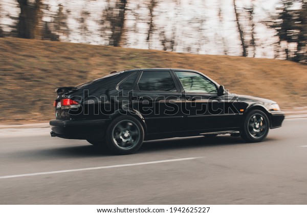 Chernigov, Ukraine - March 20, 2021:\
Old Swedish car Saab 900 Turbo on the road. Car in\
motion