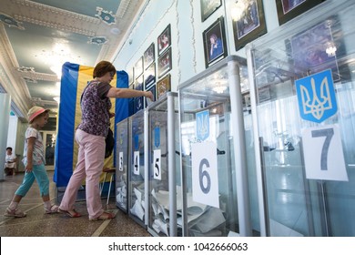 CHERNIHIV, UKRAINE - July 17, 2016: A Woman Votes At A Polling Station During Local Elections In Chernihiv, Ukraine.