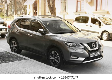 Chernihiv, Ukraine - March 31, 2020: Gray Nissan Rogue SUV Parked In The City