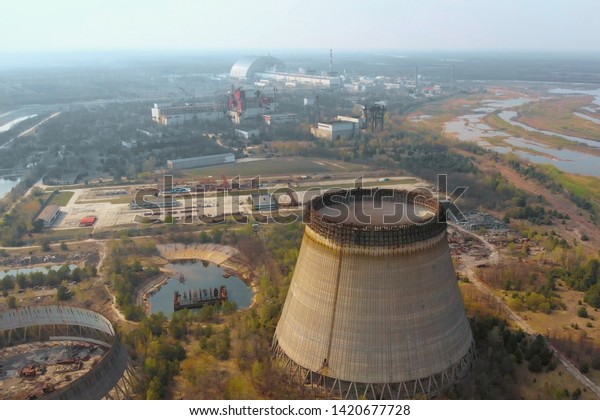 Chernobyl nuclear power plant. Cooling tower\
overlooking the nuclear power plant in Chernobyl. View of the\
destroyed nuclear power plant. Chernobyl nuclear power plant,\
aerial view. Chernobyl\
NPP