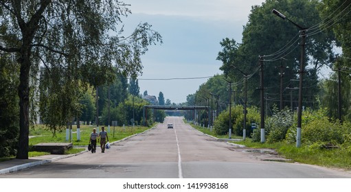 Chernobyl, Ukraine - July, 2018: A Picture Of A Chernobyl Street Surrounded By Lavish Vegetation.