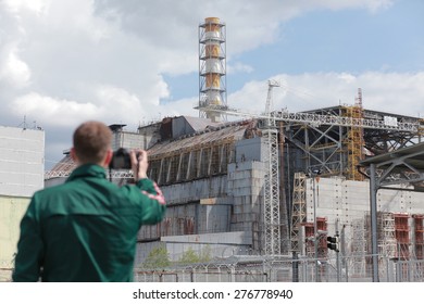 CHERNOBYL, UKRAINE - MAY 9, 2015 - Tourist Shooting Chernobyl Nuclear Power Plant