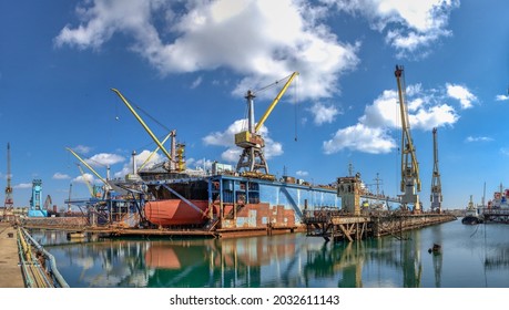 Chernomorsk, Ukraine. 21.03.2021. Large ship in dry dock of the Chernomorsk Shipyard on a sunny spring day