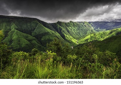 Cherrapunjee, Meghalaya, India.  Storm clouds over the beautiful Khasi Hills showing the deep valley gorges, river, and forested slopes near Cherrapunjee, Shillong, Meghalaya.