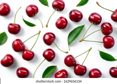 Cherries. Cherry background. Cherries top view. Cherry with leaves on white background.