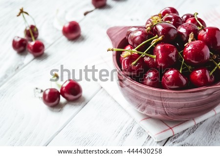 Cherries. Cherry. Cherries in color bowl and kitchen napkin. Red cherry. Fresh cherries. Cherry on white background. healthy food concept
