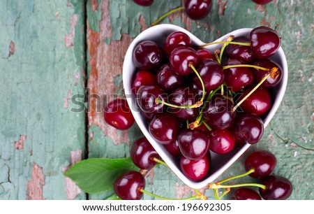 cherries in a heart-shaped bowl
