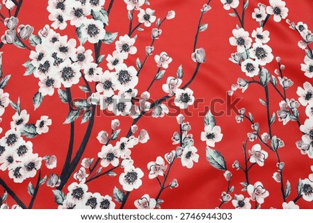 Cherry blossom flowers pattern red satin fabric background