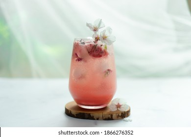 The Cherry Blossom Pink Ice Beverage On The Table.