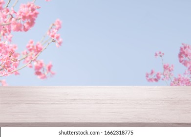 Cherry Blossom Or Sakura Flower Branch With Wooden Table 