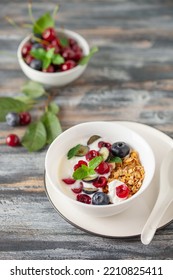 Cherry And Blueberry Granola With Yogurt. Healthy Food, Diet Breakfast.