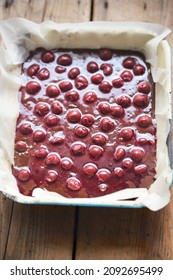 Cherry Brownie Batter In Tin Ready For The Oven