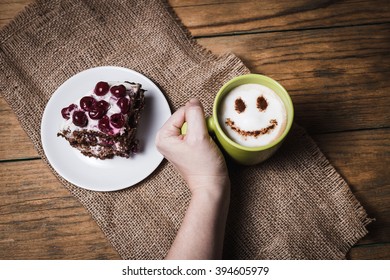 Cherry Cake With Coffee With Smile Face On Wooden Background