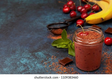 Cherry Chocolate Smoothie (black Forest) In A Jar On A Dark Blue Background