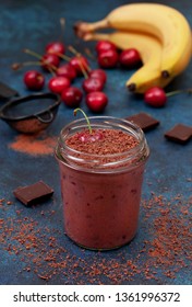 Cherry Chocolate Smoothie (black Forest) In A Jar On A Dark Blue Background