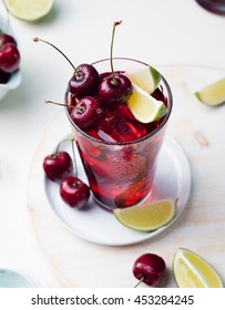 Cherry Cola, Limeade, Lemonade, Cocktail In A Tall Glass On A White Background