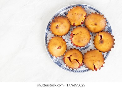 Cherry Cup Cakes Served On The Plate Above White Background