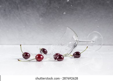 Cherry Fruits And Broken Martini Glass