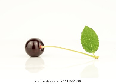 Cherry with green leaf - Shutterstock ID 1111551599